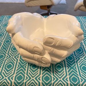 White scooped hands. In a bowel shape. Grips on the bottom to stay in place.